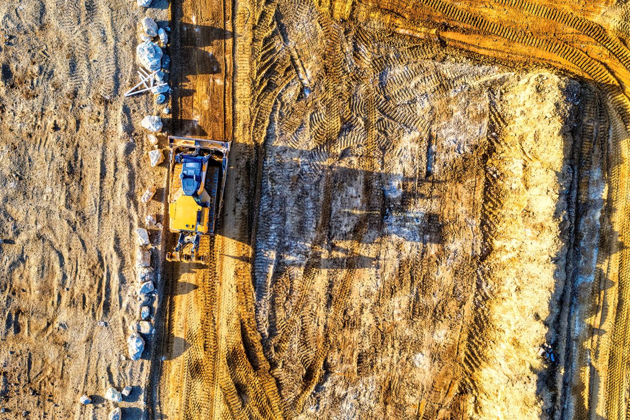Crafting Captivating Headlines: Your awesome post title goes here Aerial view of a bulldozer working on a dirt road at a construction site in Rochester, MN.